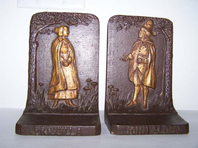 A pair of antique Bookends by Bradley & Hubbard depicting Pilgrim Father John Alden and his wife Priscilla, circa 1910.